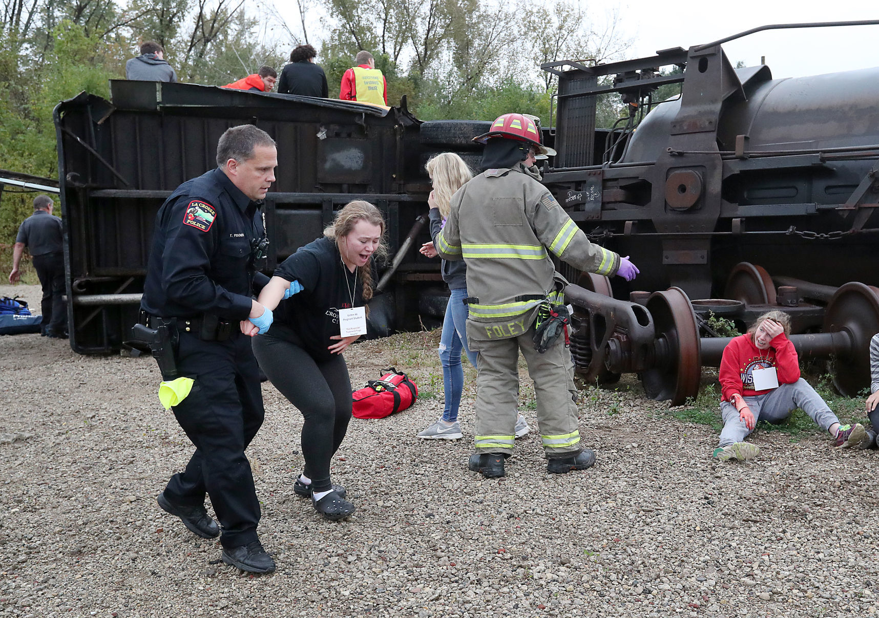 Rescuers help victims to triage area